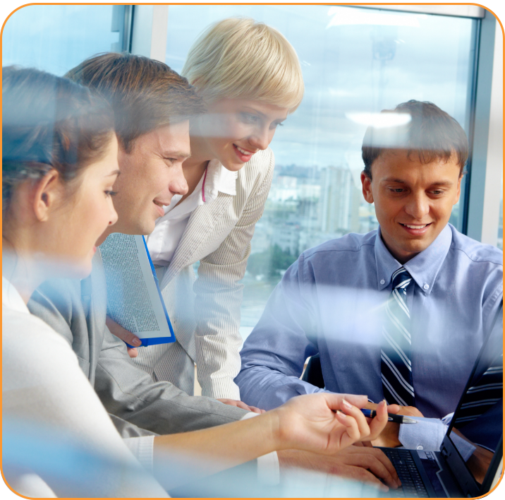 business team looking at laptop screen