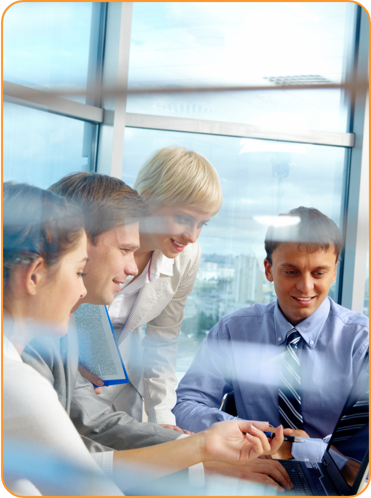 business team looking at laptop screen